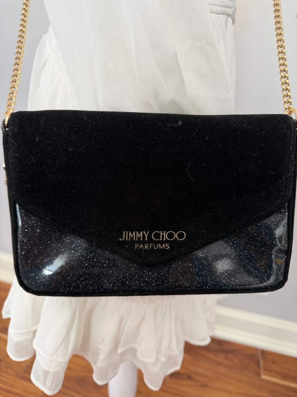 Jimmy Choo parfums NWOT black and gold Crossbody bag. Gold chain.